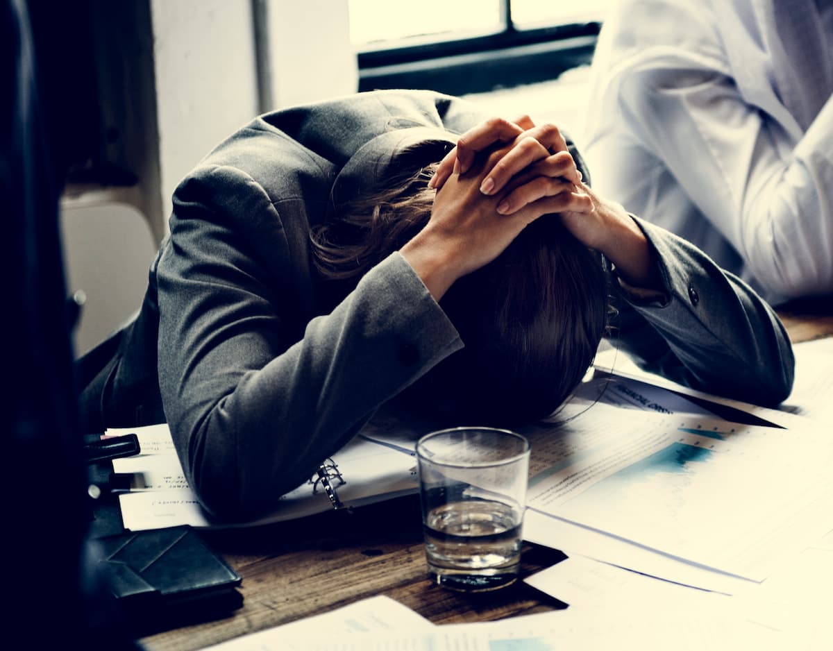 overworked-business-professional-at-desk-feeling-s-2026-09-15-20-22-36-utc (1)